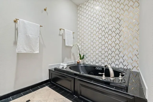 a bathroom with a glass door shower