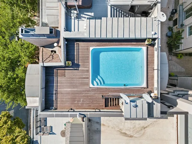 an aerial view of multiple houses with outdoor space