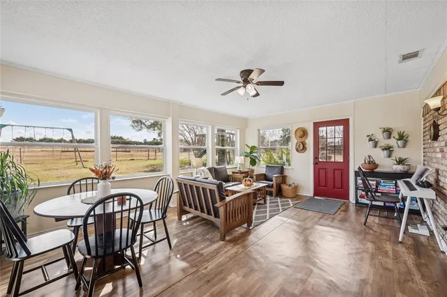 a view of a dining room with furniture window and wooden floor