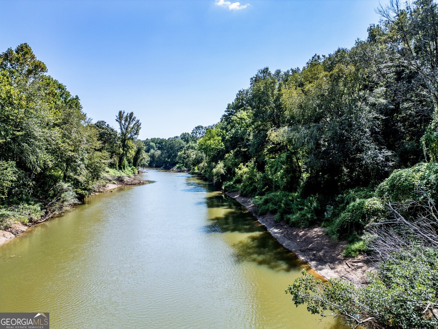 a view of a lake from a yard
