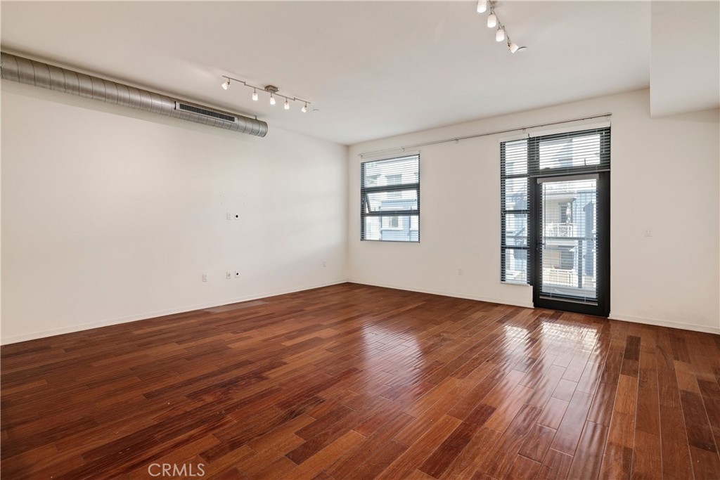 133 The Promenade North, Unit 426 Long Beach, CA 90802 - Photo 2 of 57 wooden floor in an empty room with a window