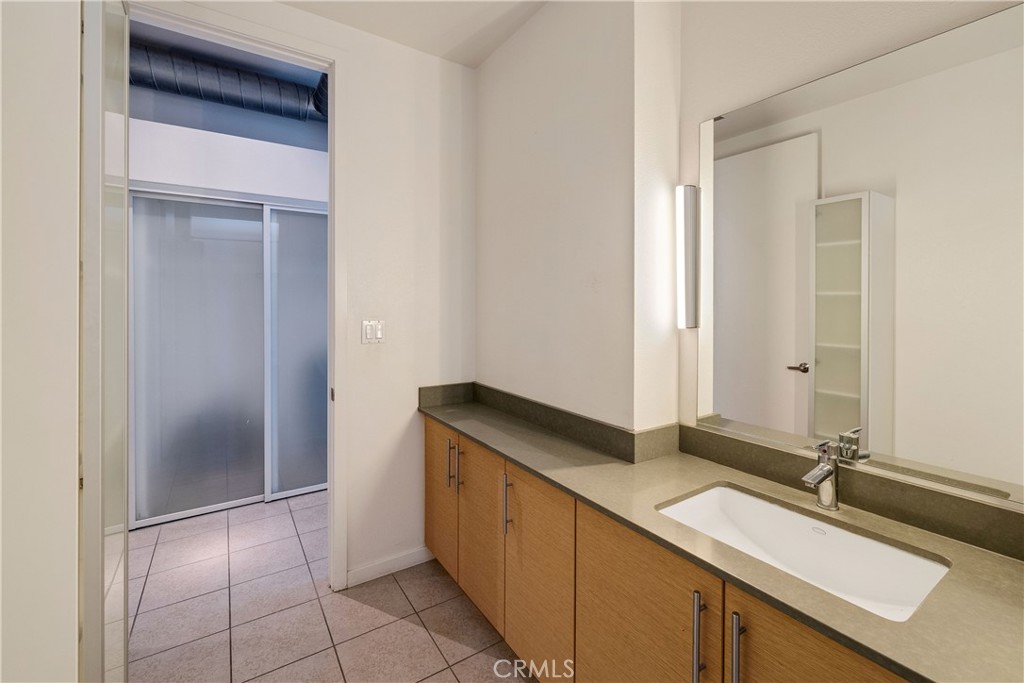 133 The Promenade North, Unit 426 Long Beach, CA 90802 - Photo 27 of 57 a room with a sink and a mirror