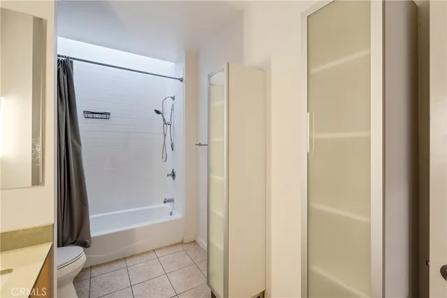 a kitchen with stainless steel appliances a sink and a refrigerator