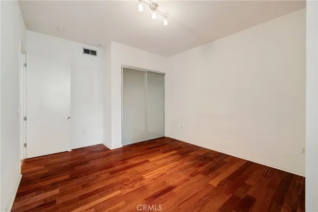 a room with gym equipment and a flat screen tv