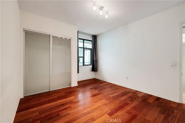 a kitchen with stainless steel appliances granite countertop a refrigerator and a stove