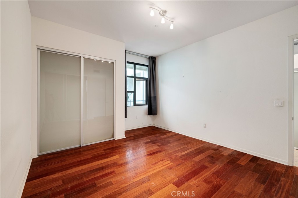133 The Promenade North, Unit 426 Long Beach, CA 90802 - Photo 36 of 57 wooden floor in an empty room