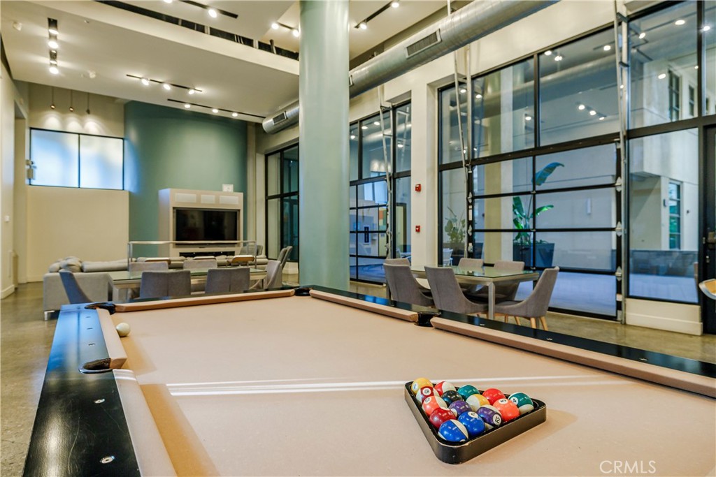 133 The Promenade North, Unit 426 Long Beach, CA 90802 - Photo 38 of 57 a room with gym equipment and a flat screen tv