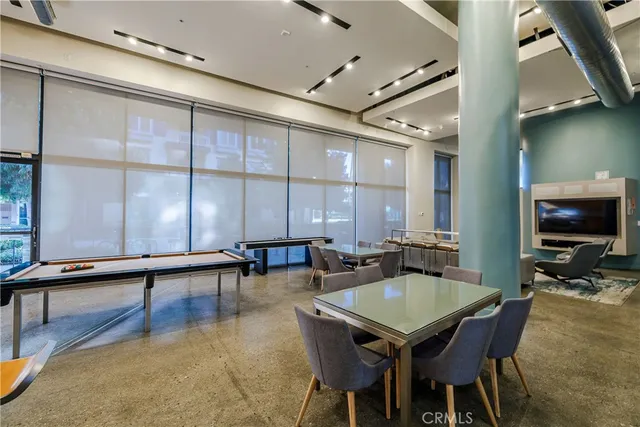 a view of swimming pool and outdoor seating