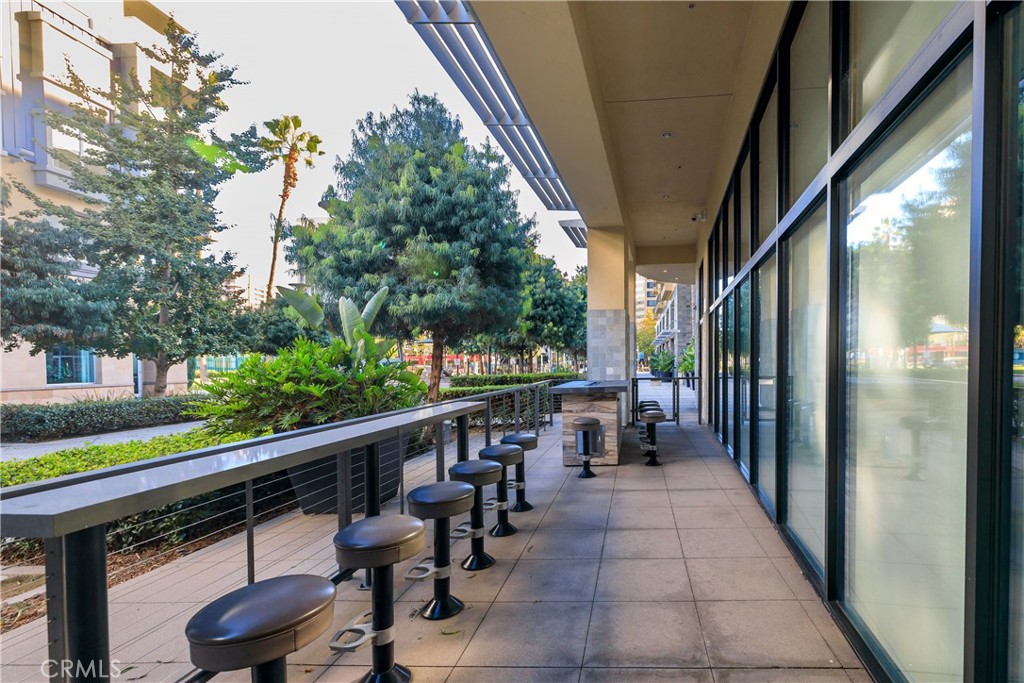 133 The Promenade North, Unit 426 Long Beach, CA 90802 - Photo 42 of 57 a view of a patio with table and chairs and potted plants