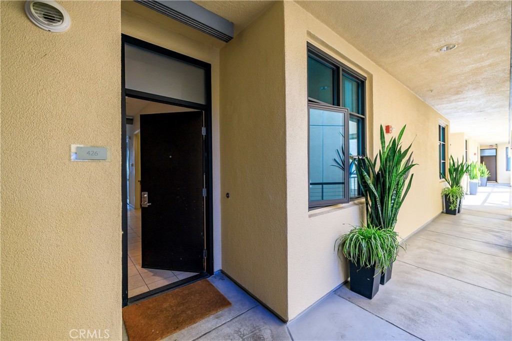 133 The Promenade North, Unit 426 Long Beach, CA 90802 - Photo 10 of 57 a potted plant in front of a door