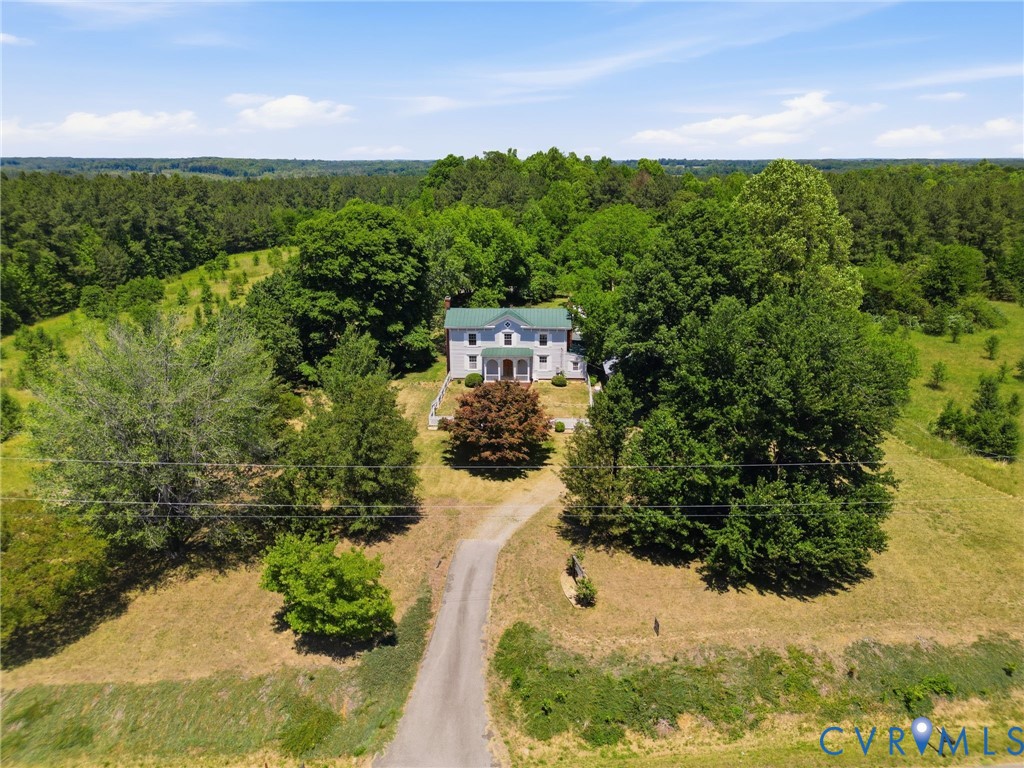 2297 Indian Oak Road Crewe, VA 23930 - Photo 44 of 53 a view of a yard with plants and large trees