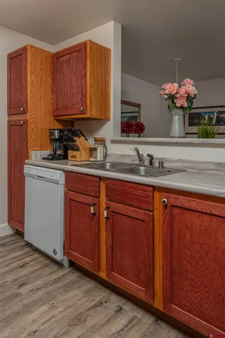 a kitchen with sink and cabinets