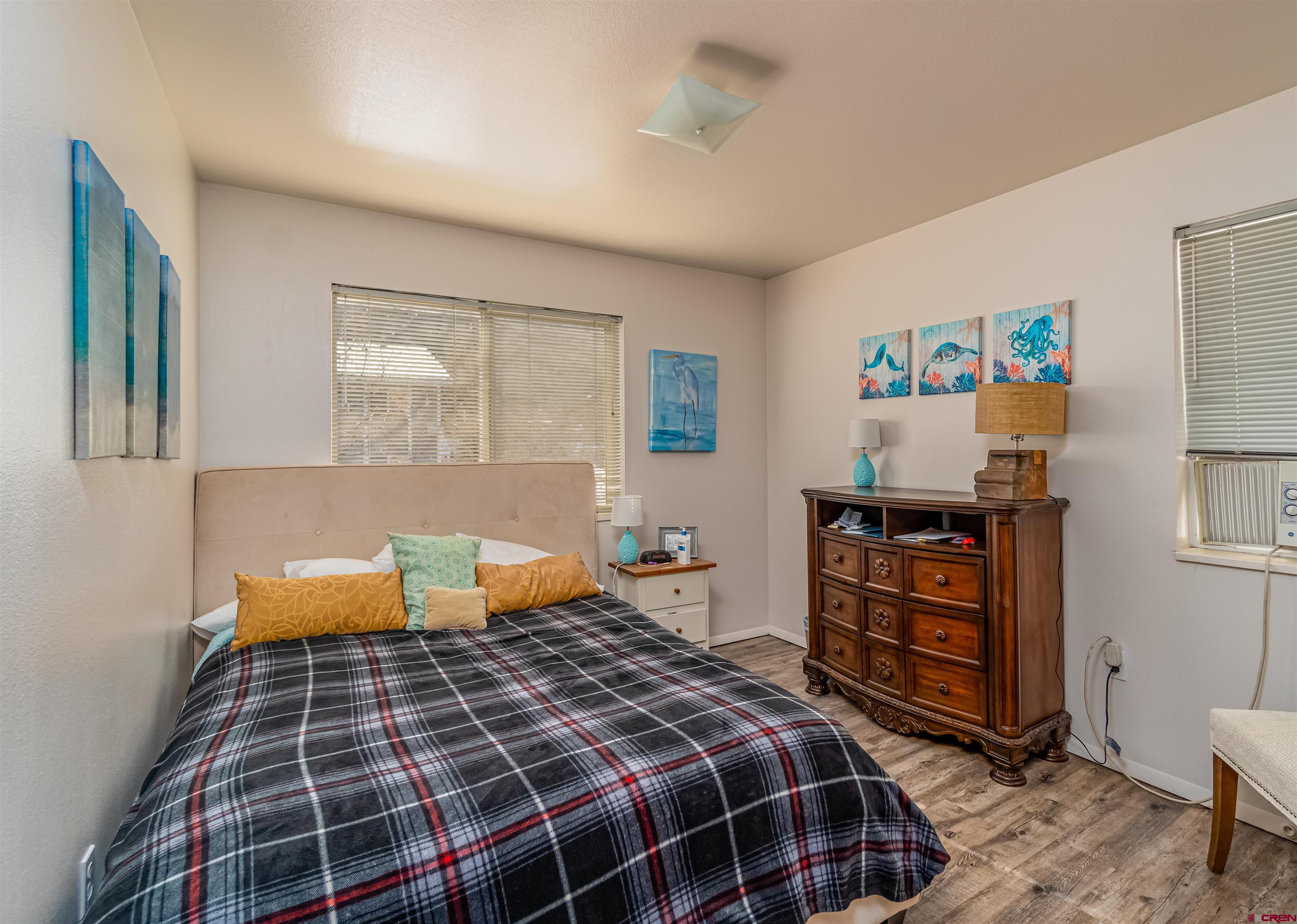60 Westwood Place Durango, CO 81301 - Photo 6 of 16 a bedroom with a bed and wooden floor