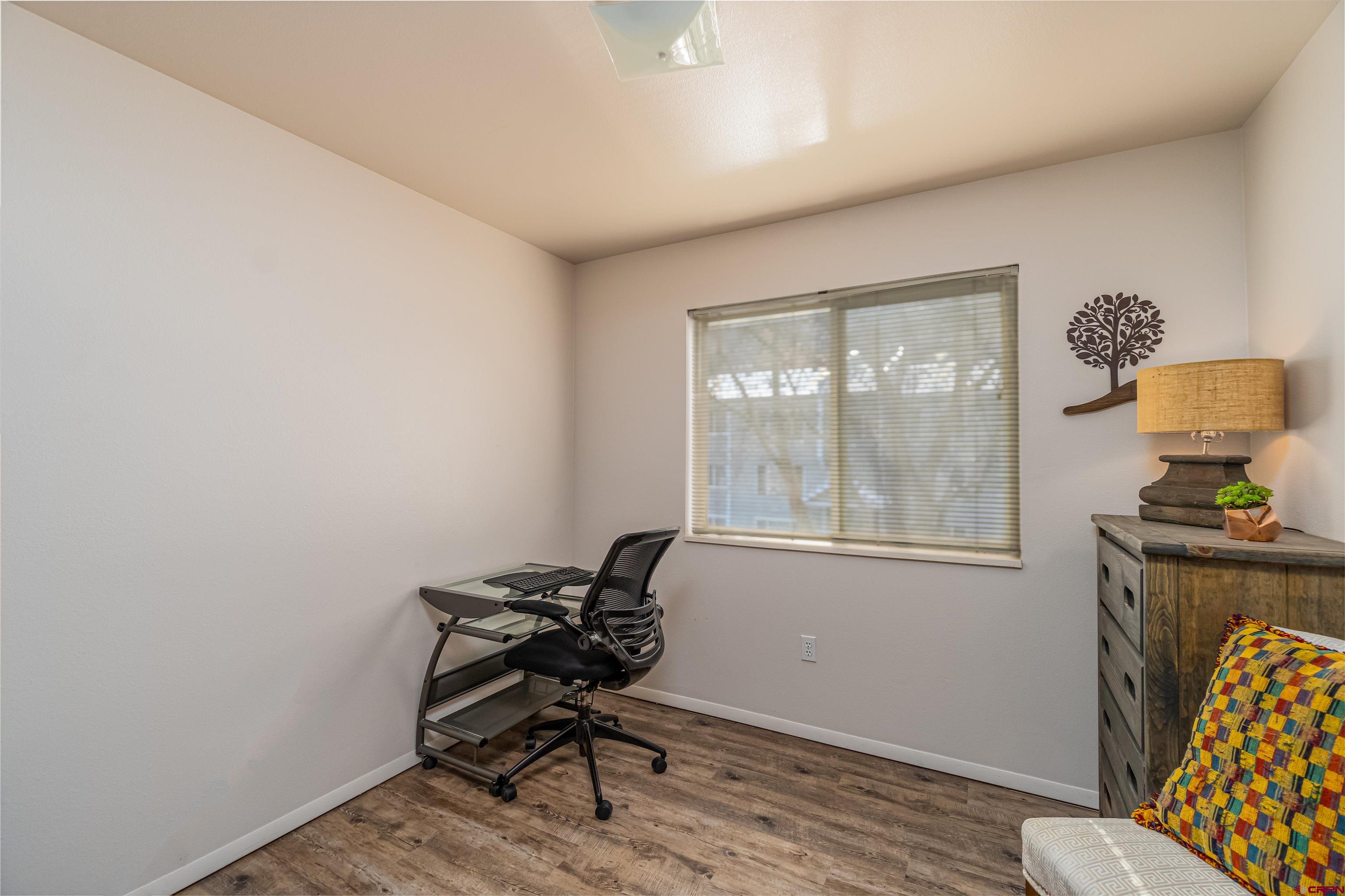 60 Westwood Place Durango, CO 81301 - Photo 7 of 16 a view of a workspace with furniture and a window