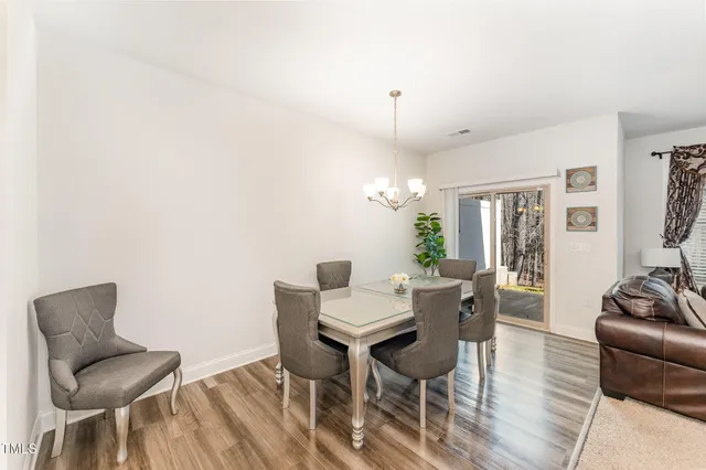 a view of a livingroom with furniture and wooden floor