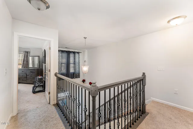 a view of a hallway with bedroom and closet