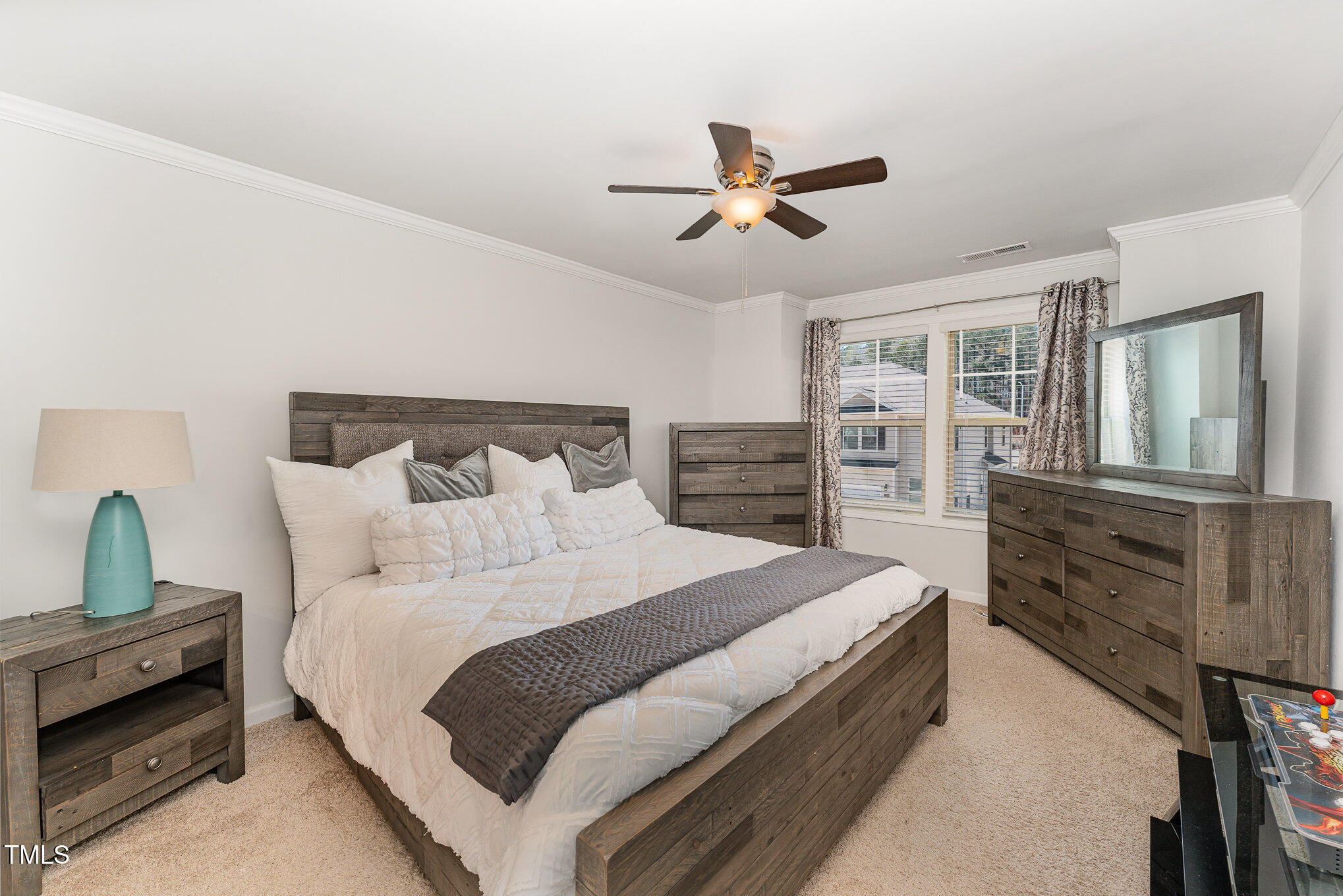 1101 Longitude Drive Durham, NC 27713 - Photo 14 of 26 a bedroom with a bed and a dresser