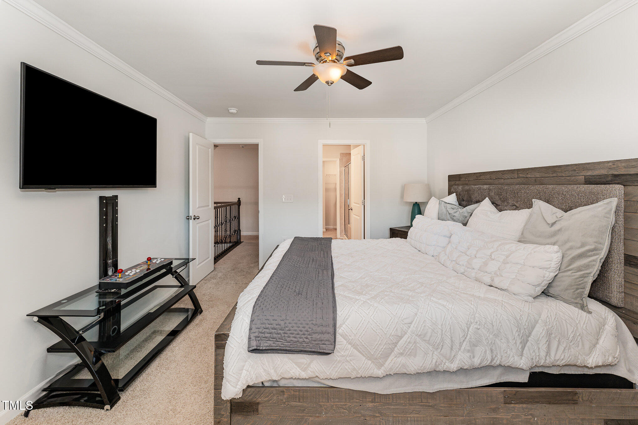 1101 Longitude Drive Durham, NC 27713 - Photo 15 of 26 a spacious bedroom with a bed and a flat screen tv