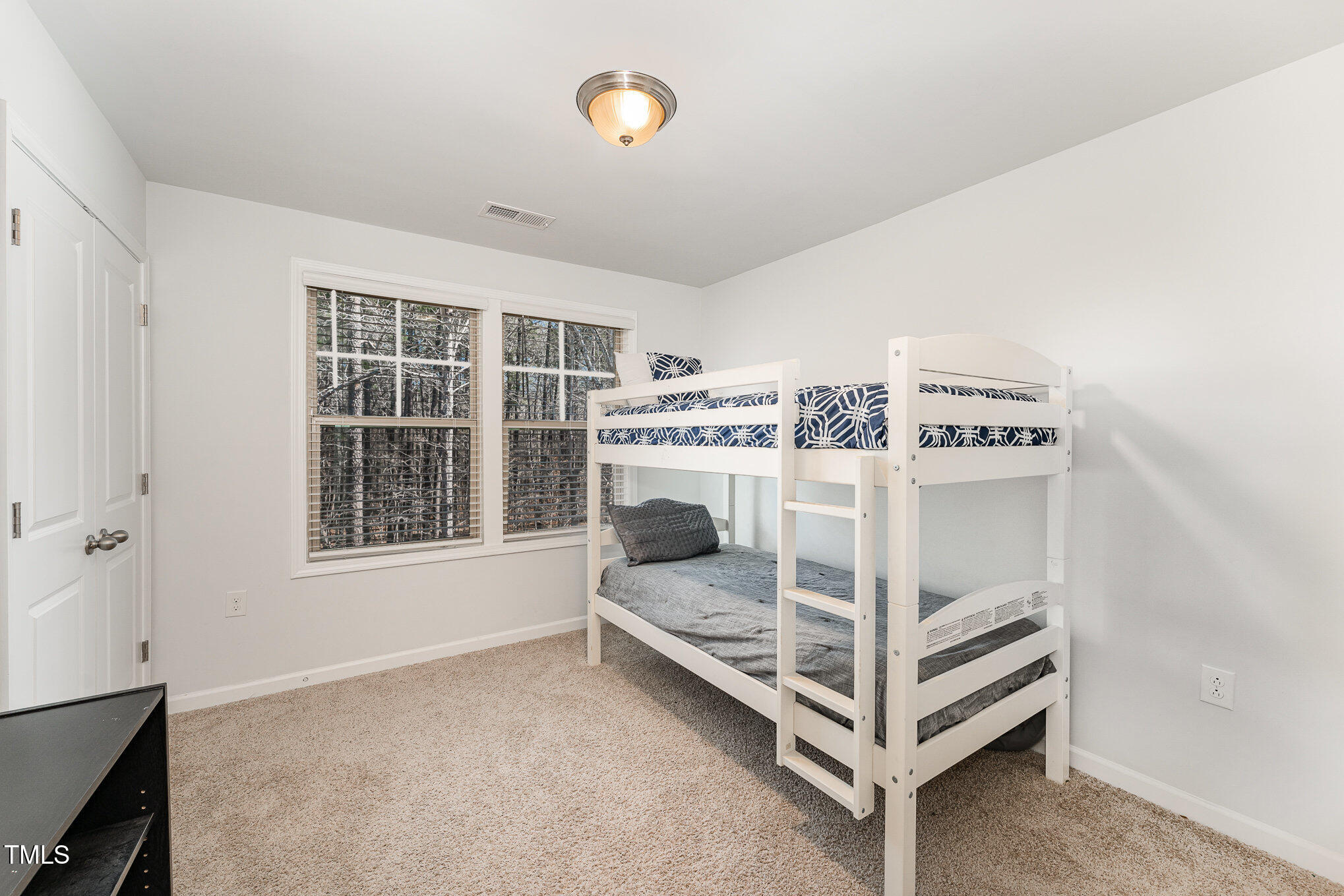 1101 Longitude Drive Durham, NC 27713 - Photo 22 of 26 a bedroom with a bed and a window