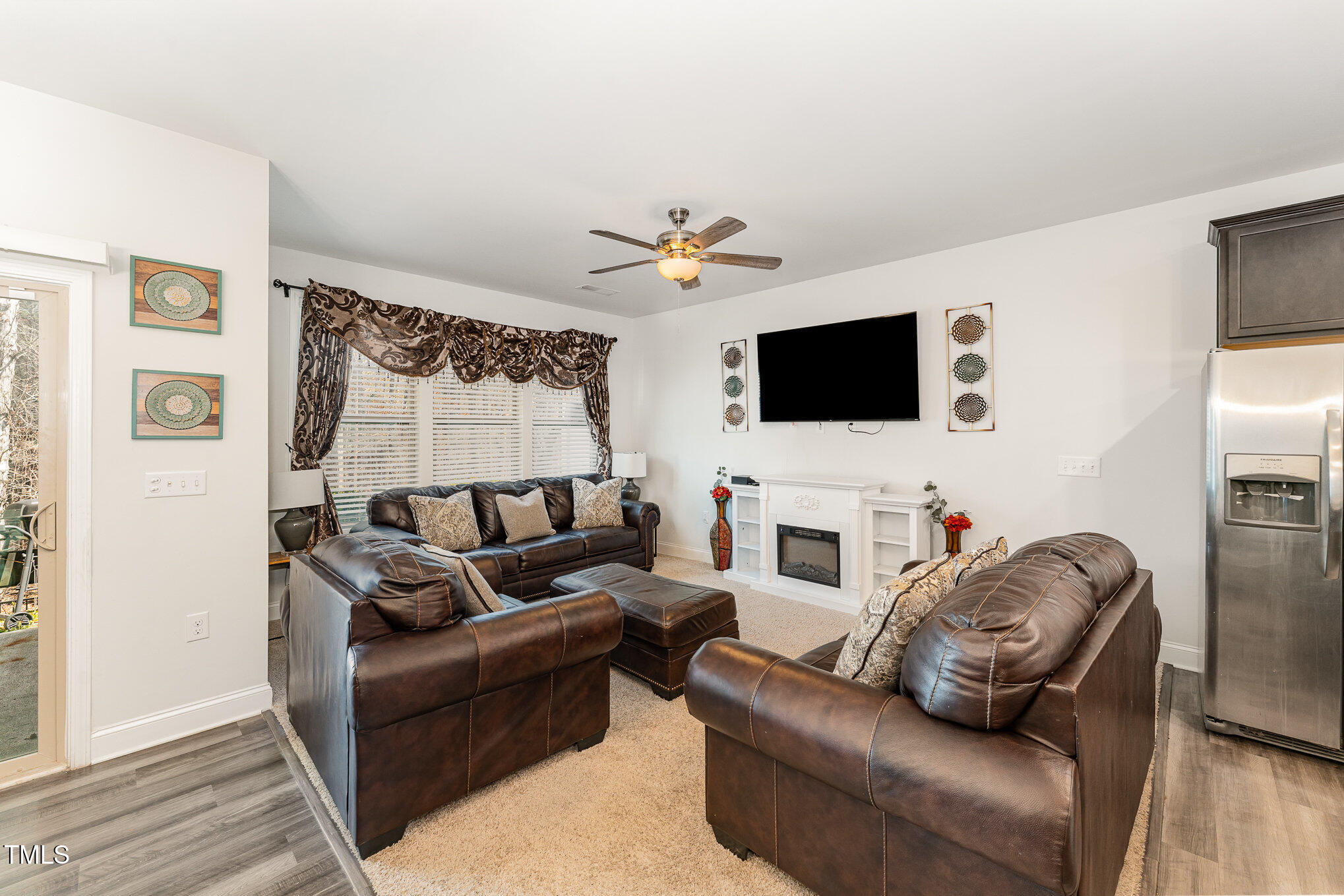 1101 Longitude Drive Durham, NC 27713 - Photo 5 of 26 a living room with furniture and a flat screen tv