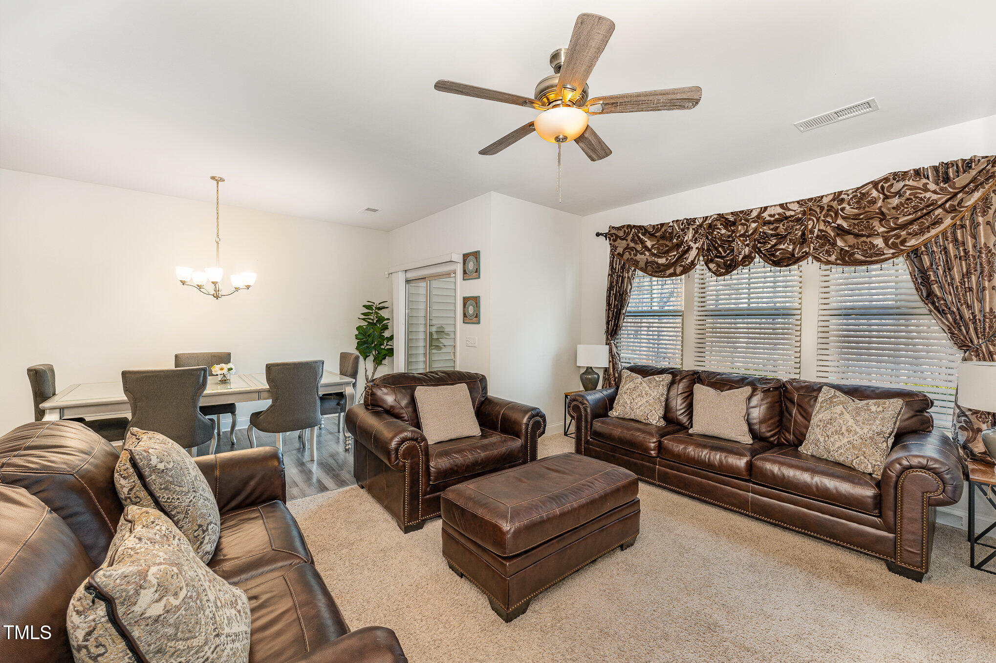 1101 Longitude Drive Durham, NC 27713 - Photo 6 of 26 a living room with furniture and a ceiling fan