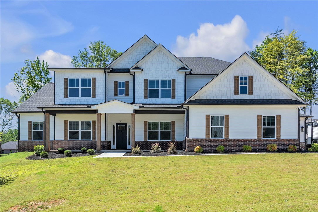 226 Holly Br Road Piedmont, SC 29673 - Photo 2 of 44 Elegant gables and wooden shutters accent this inviting residence with its deep, welcoming porch.