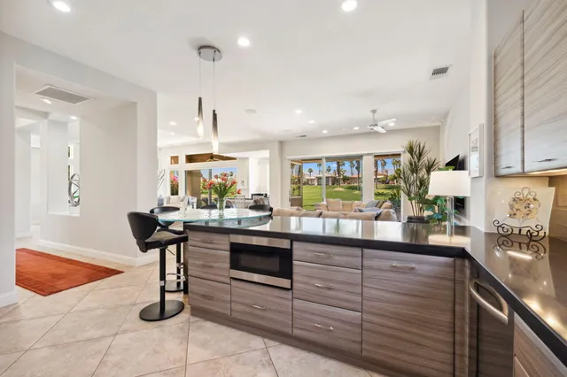 a large kitchen with a table and chairs