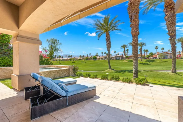 a view of a patio with a yard