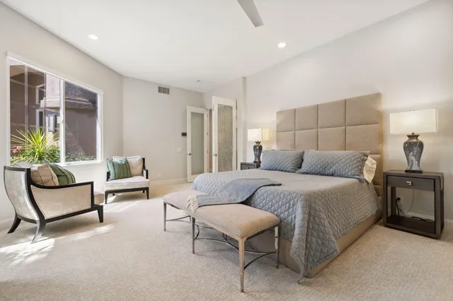 a bathroom with a sink double vanity and a mirror