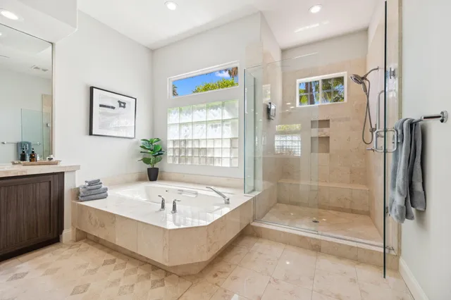 a bedroom with a bed and a night stand