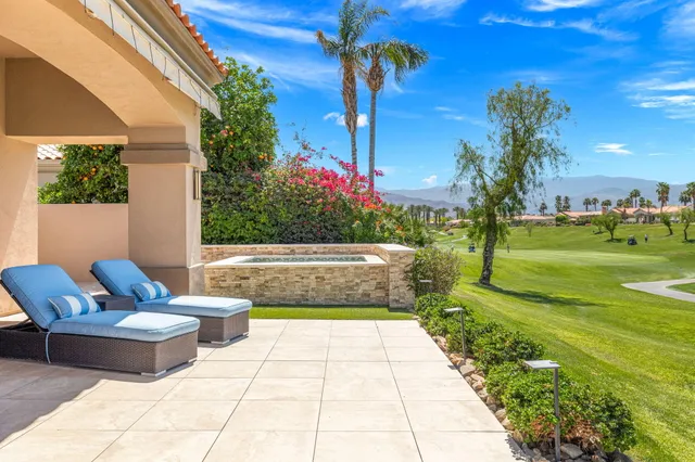a view of a swimming pool with a lounge chair