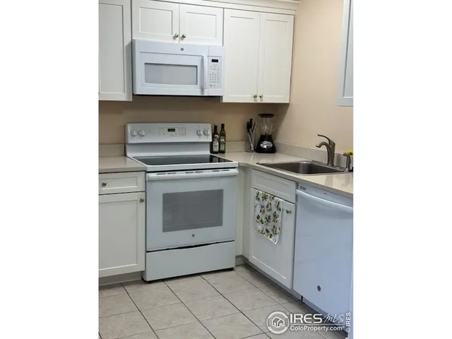 a kitchen with a stove and a sink