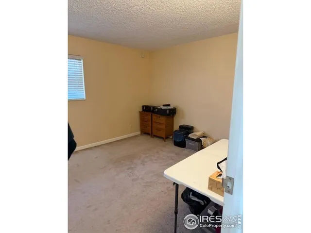 a view of water heater and a wall