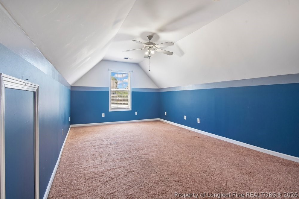 10 Pender Road Spring Lake, NC 28390 - Photo 14 of 35 en empty room with windows and ceiling fan