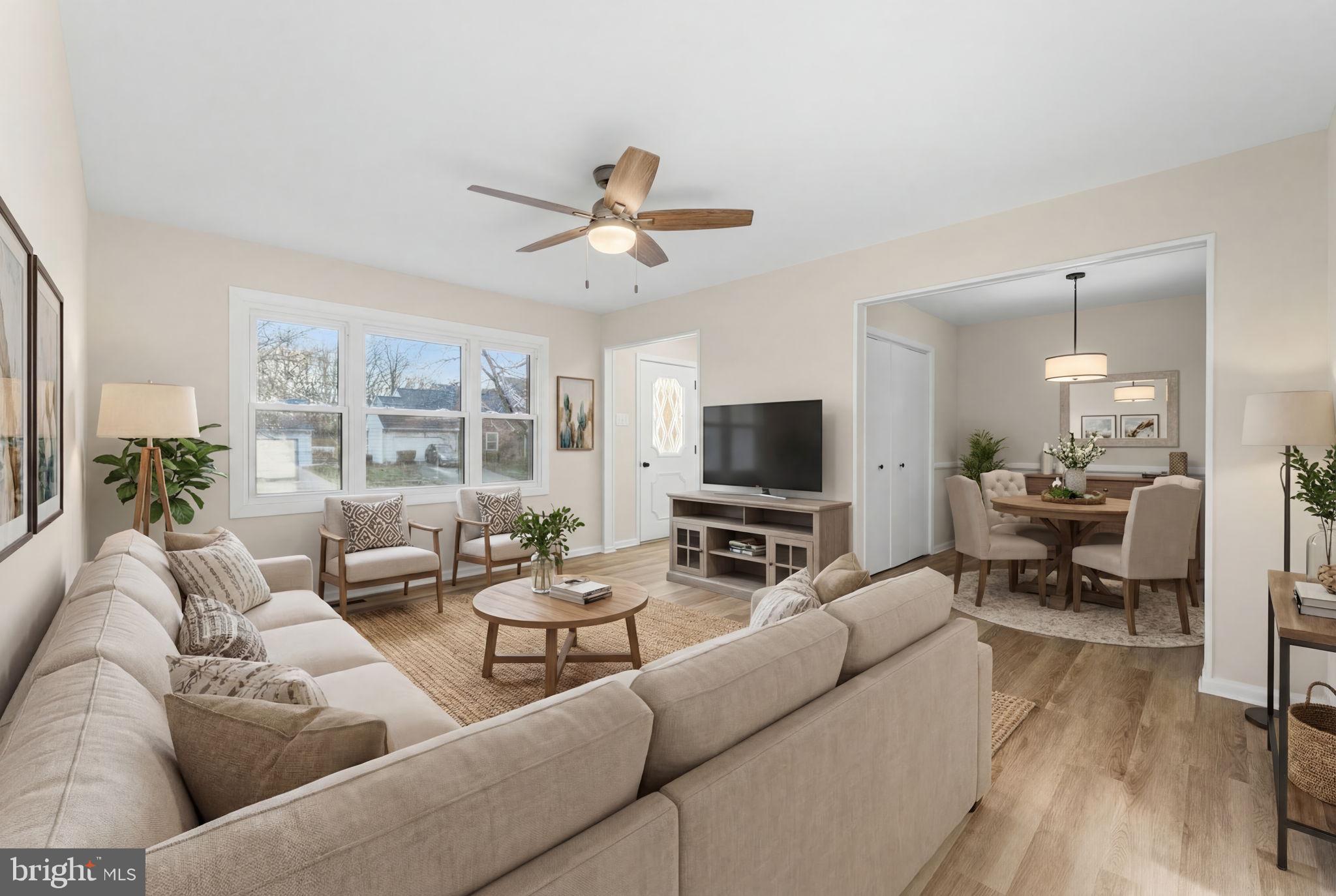 819 Old Harmony Road Newark, DE 19711 - Photo 2 of 39 a living room with furniture and a flat screen tv