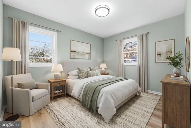 a spacious bedroom with a bed and a couch