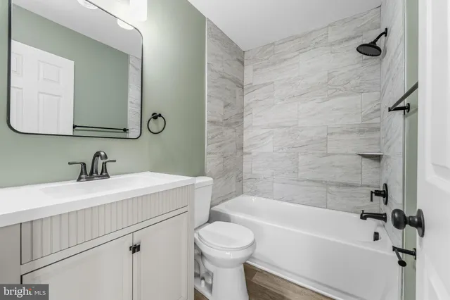 a view of empty room with wooden walls