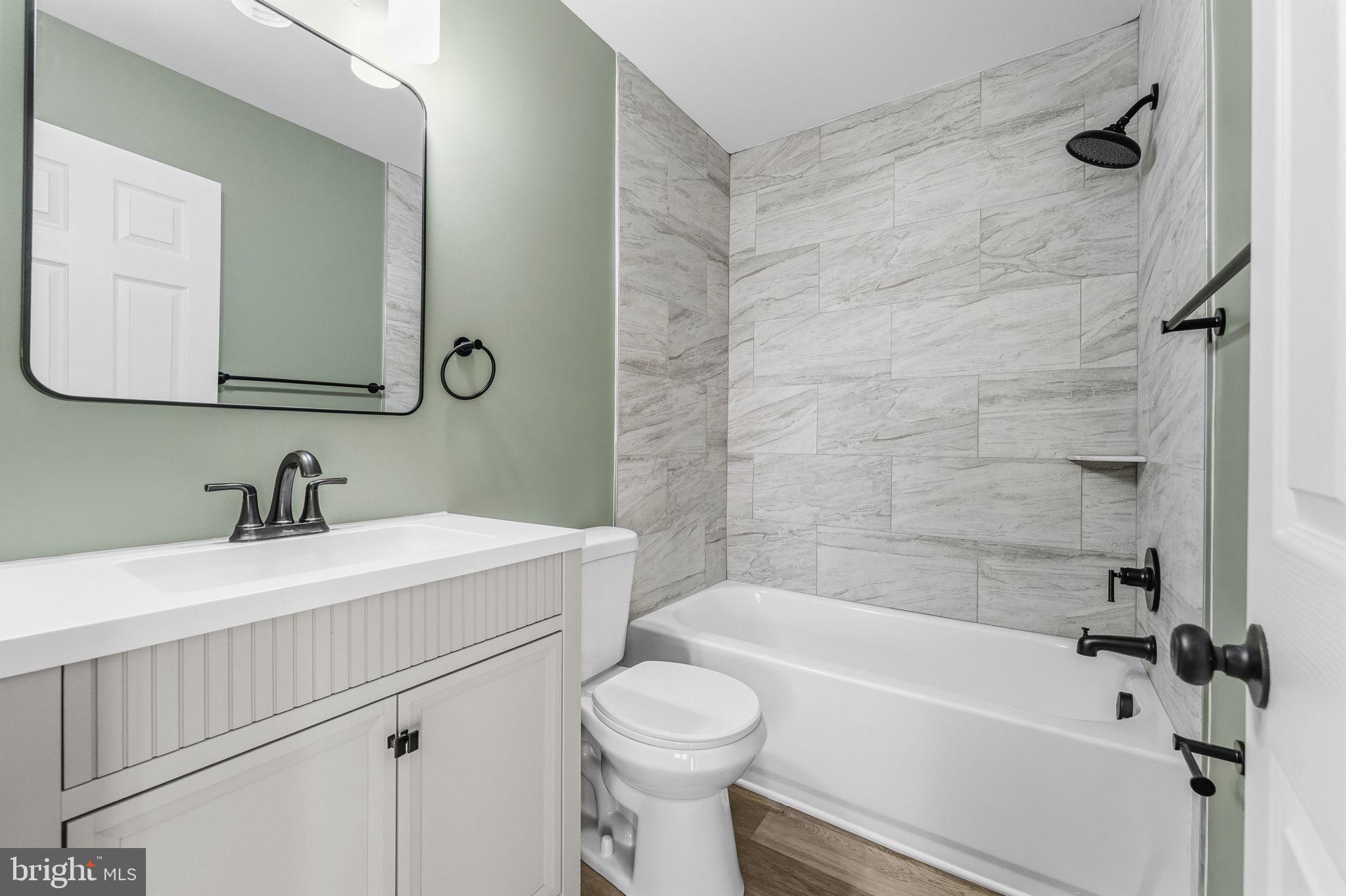 819 Old Harmony Road Newark, DE 19711 - Photo 25 of 39 a bathroom with a sink a toilet and a bathtub