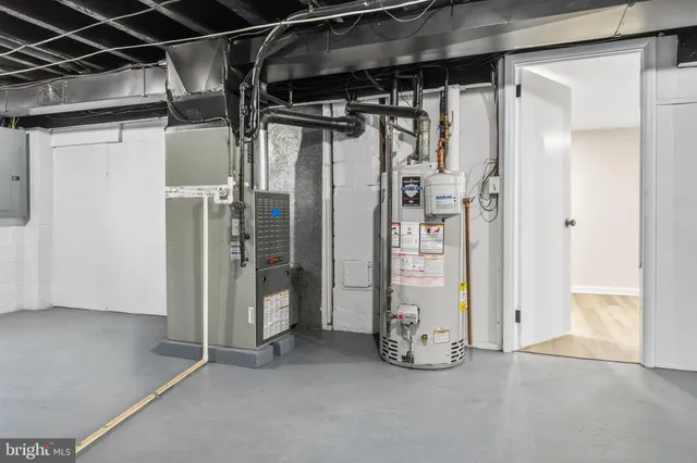 a view of an empty room with wooden walls