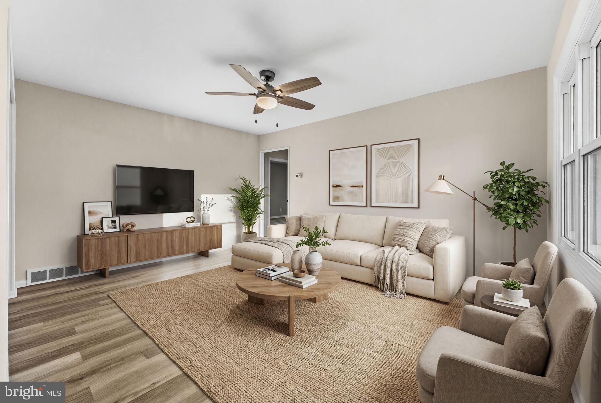 819 Old Harmony Road Newark, DE 19711 - Photo 3 of 39 a living room with furniture and a flat screen tv