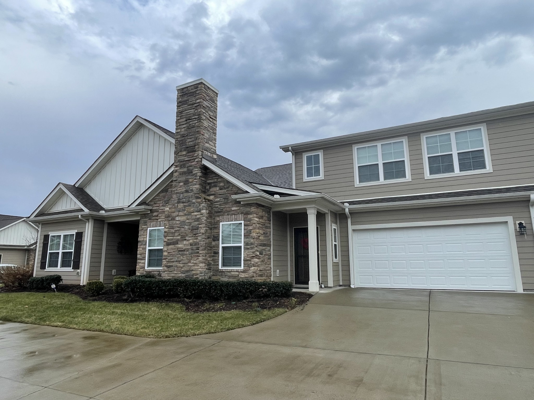 2252 Stonecenter Lane Murfreesboro, TN 37128 - Photo 2 of 36 a front view of a house with a yard and garage