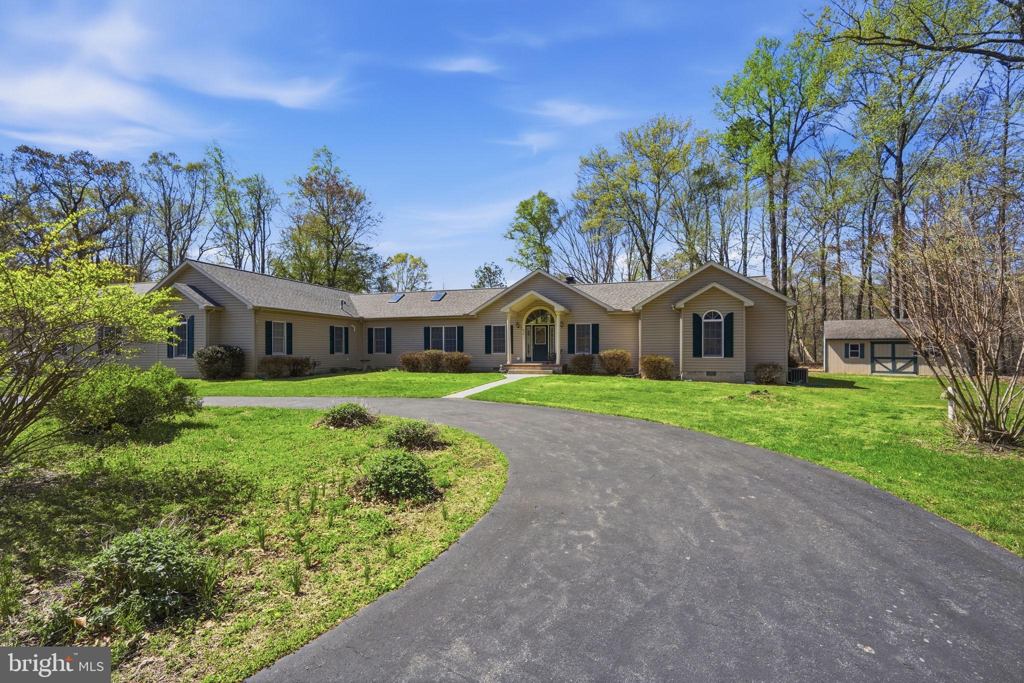 930 Spaniard Neck Road Centreville, MD 21617 - Photo 3 of 91 Charming home nestled in lush greenery.