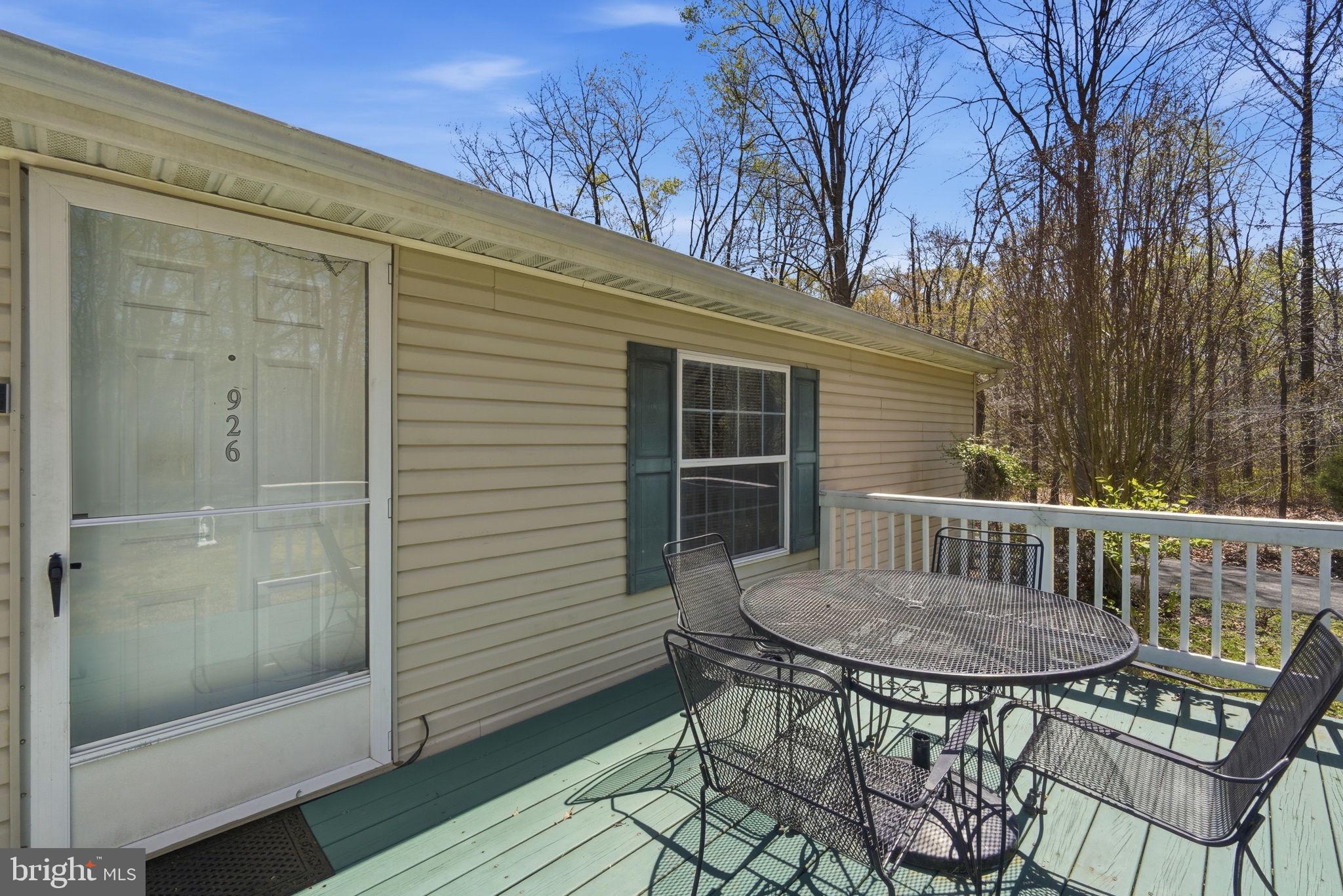 930 Spaniard Neck Road Centreville, MD 21617 - Photo 49 of 91 Charming deck for serene outdoor moments.