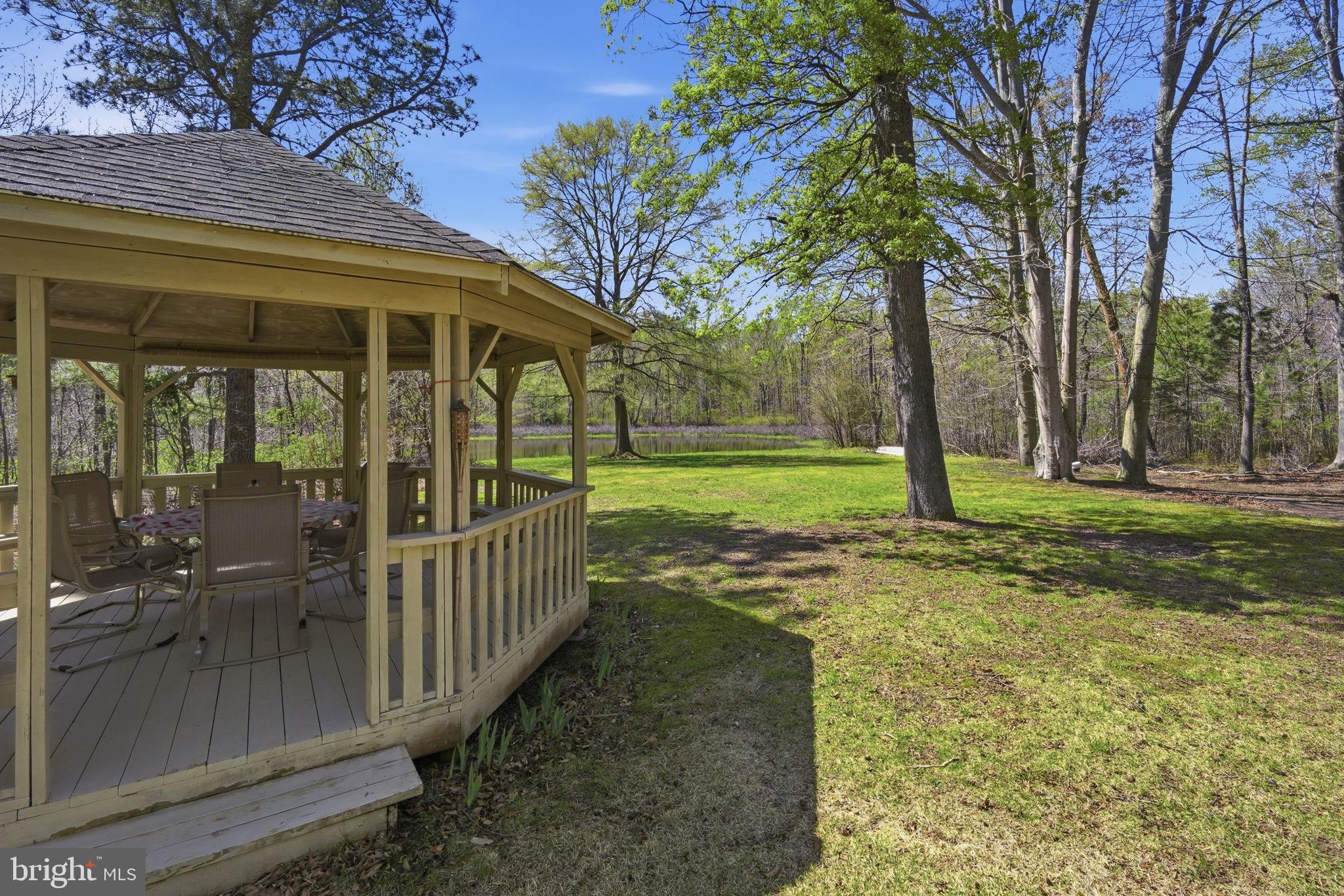 930 Spaniard Neck Road Centreville, MD 21617 - Photo 69 of 91 Serene gazebo in lush greenery.