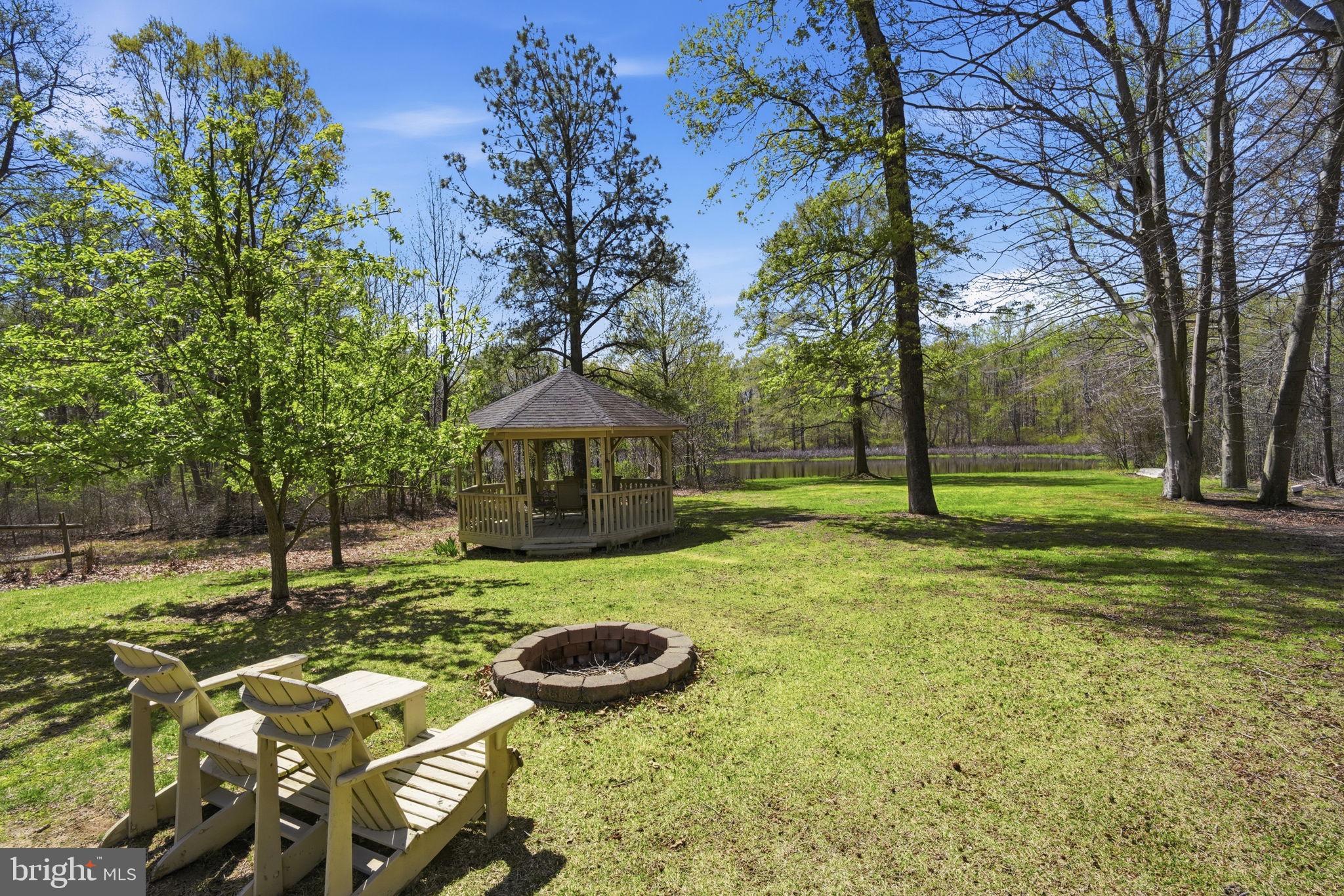 930 Spaniard Neck Road Centreville, MD 21617 - Photo 73 of 91 Serene backyard with gazebo and firepit.