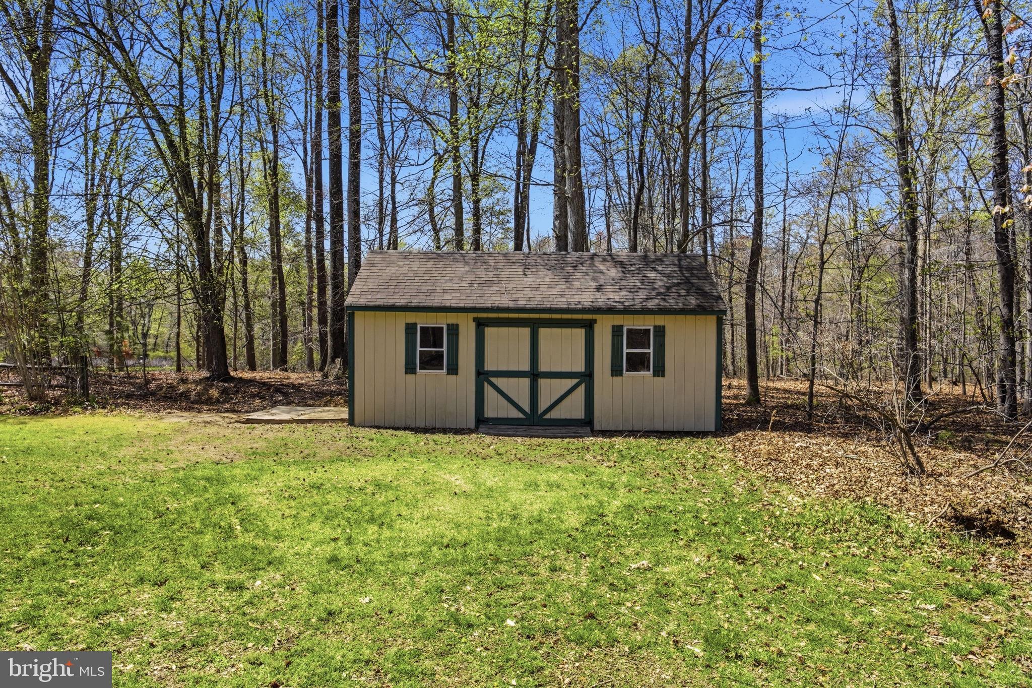 930 Spaniard Neck Road Centreville, MD 21617 - Photo 88 of 91 Charming shed nestled in serene woods.