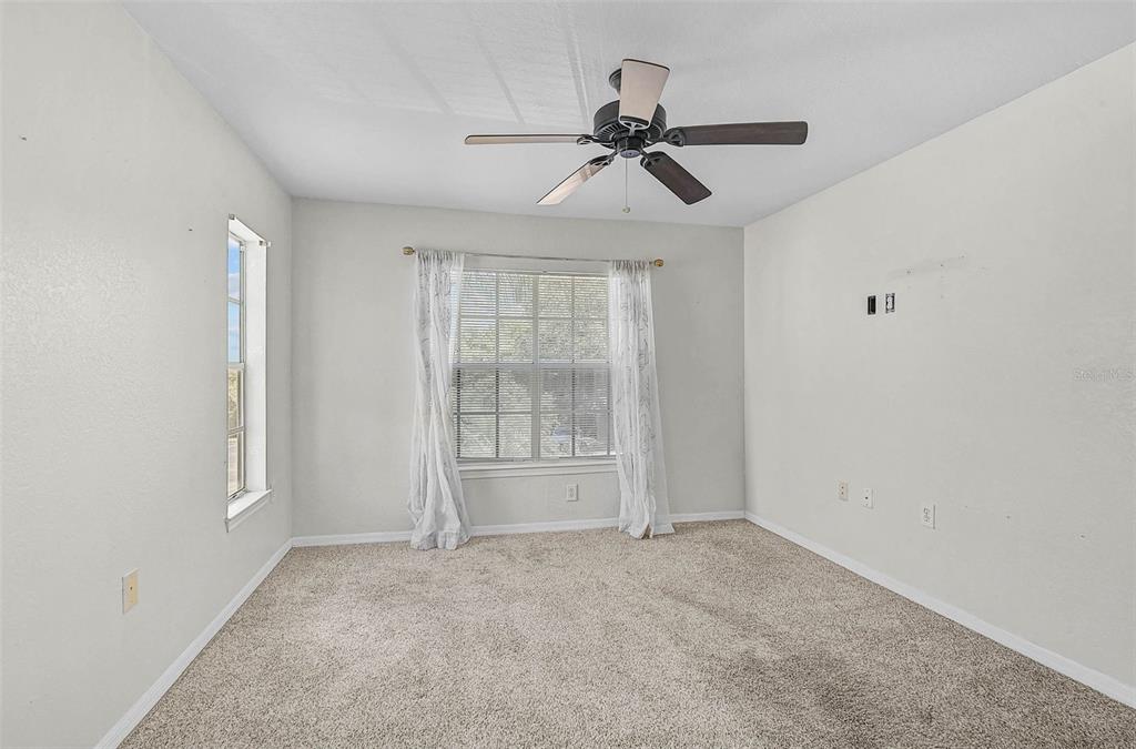 8827 Manor Loop, Unit 204 Lakewood Ranch, FL 34202 - Photo 13 of 31 a view of an empty room with a window