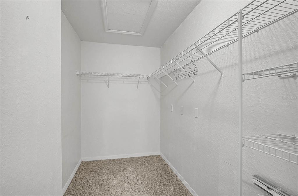 8827 Manor Loop, Unit 204 Lakewood Ranch, FL 34202 - Photo 14 of 31 a view of a room with racks on the wall
