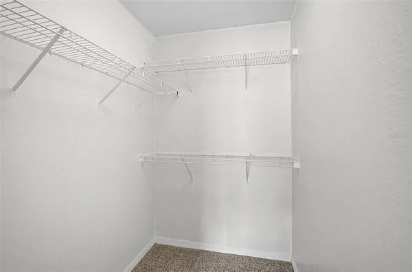 a view of a room with racks on the wall