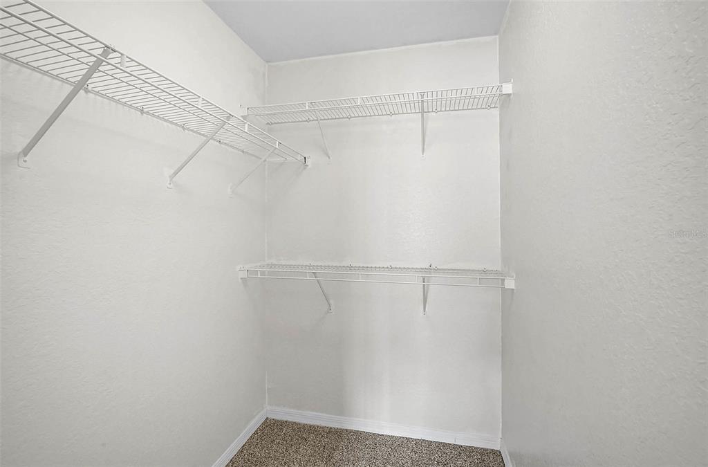 8827 Manor Loop, Unit 204 Lakewood Ranch, FL 34202 - Photo 18 of 31 a view of a room with racks on the wall
